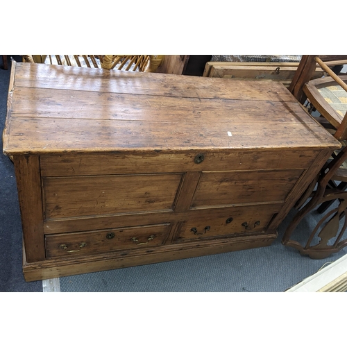 596 - An 18th century pine dower chest having a hinged top with two drawers below. 48cm d x 111cm w x 64 c... 