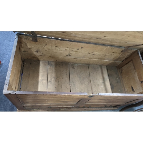 596 - An 18th century pine dower chest having a hinged top with two drawers below. 48cm d x 111cm w x 64 c... 