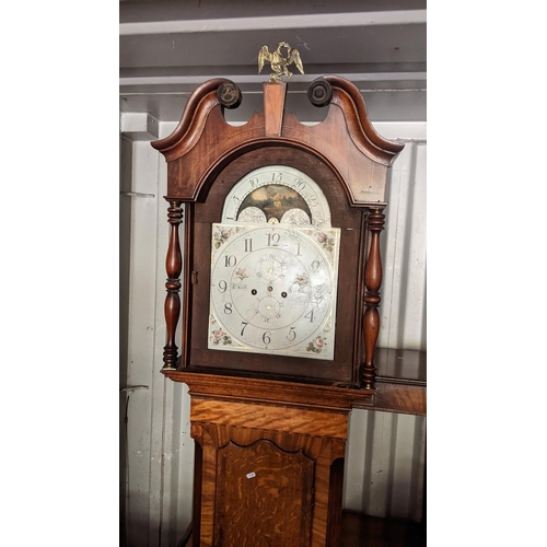 597 - A George III oak cased 8 day longcase clock having a broken swan neck pediment, arched dial and stri... 