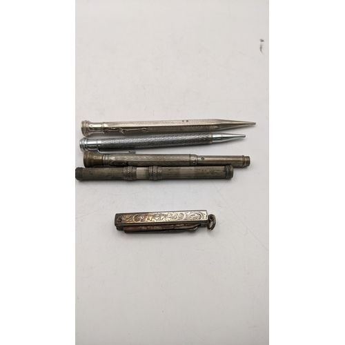 561 - Four propelling pencils to include one Superite example and others, along with a silver pen knife, c... 