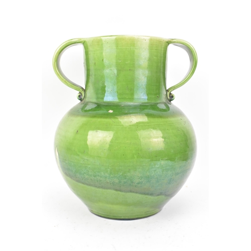 1 - An Arts & Crafts Liberty twin handled vase, having a green glaze, globular body, twin scroll handles... 