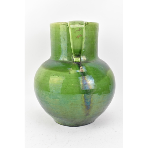 1 - An Arts & Crafts Liberty twin handled vase, having a green glaze, globular body, twin scroll handles... 