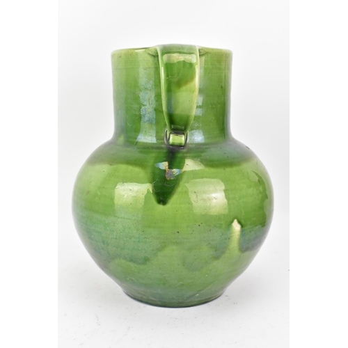 1 - An Arts & Crafts Liberty twin handled vase, having a green glaze, globular body, twin scroll handles... 