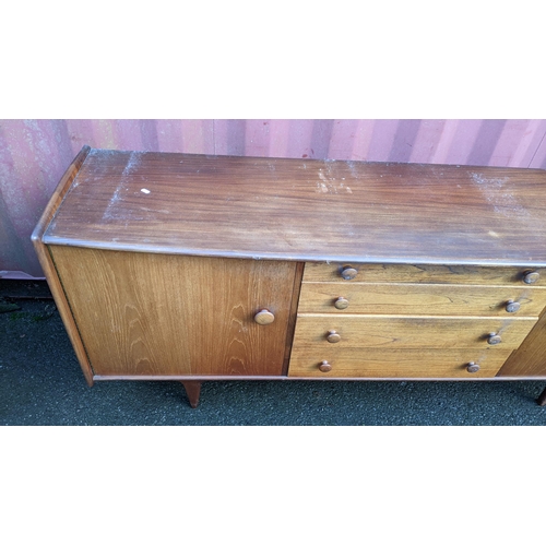 100 - John Herbert for A. Younger Ltd - A 1960s teak Volany sideboard, having a slightly curved top over f... 