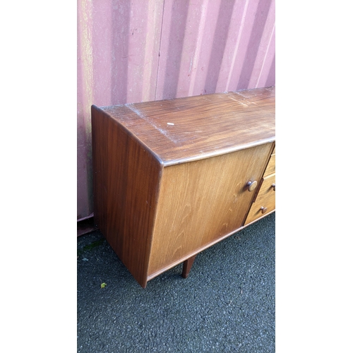 100 - John Herbert for A. Younger Ltd - A 1960s teak Volany sideboard, having a slightly curved top over f... 