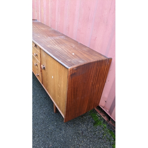 100 - John Herbert for A. Younger Ltd - A 1960s teak Volany sideboard, having a slightly curved top over f... 