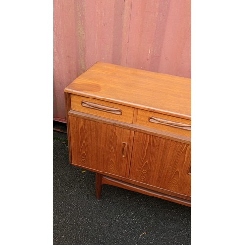 106 - A mid 20th century G-Plan Fresco range teak sideboard, designed by Victor B Wilkins, having four dra... 