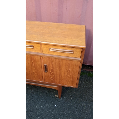 106 - A mid 20th century G-Plan Fresco range teak sideboard, designed by Victor B Wilkins, having four dra... 