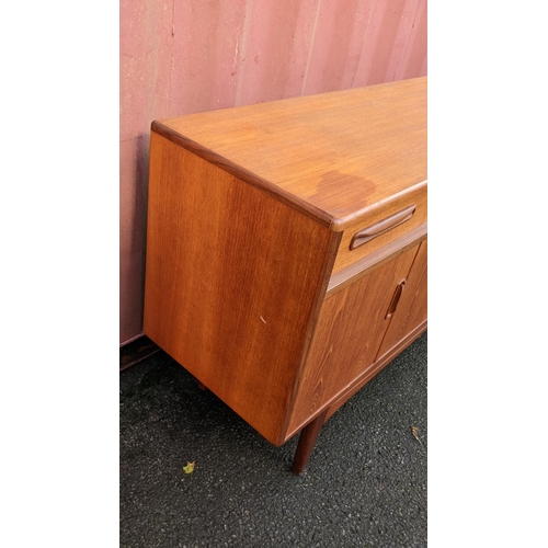 106 - A mid 20th century G-Plan Fresco range teak sideboard, designed by Victor B Wilkins, having four dra... 