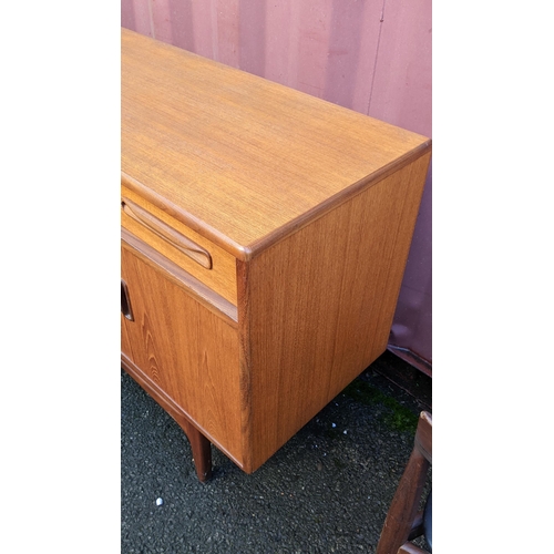 106 - A mid 20th century G-Plan Fresco range teak sideboard, designed by Victor B Wilkins, having four dra... 