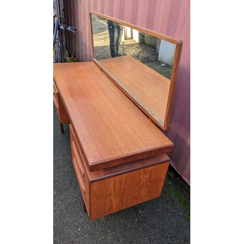 107 - A mid 20th century G-Plan Fresco range teak dressing table, designed by Victor B Wilkins, having a m... 