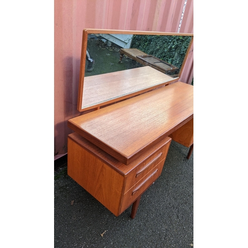 107 - A mid 20th century G-Plan Fresco range teak dressing table, designed by Victor B Wilkins, having a m... 