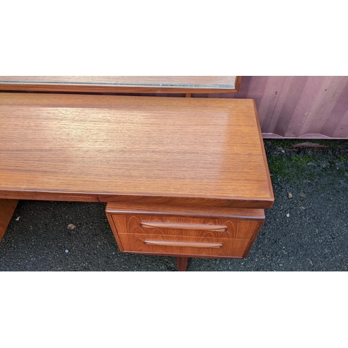 107 - A mid 20th century G-Plan Fresco range teak dressing table, designed by Victor B Wilkins, having a m... 