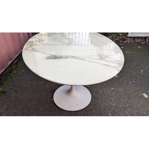 108 - Eero Saarinen (1910-1961) A Tulip dining table, having a white lacquered base with oval marble top, ... 