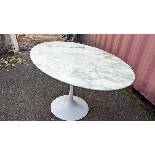 108 - Eero Saarinen (1910-1961) A Tulip dining table, having a white lacquered base with oval marble top, ... 