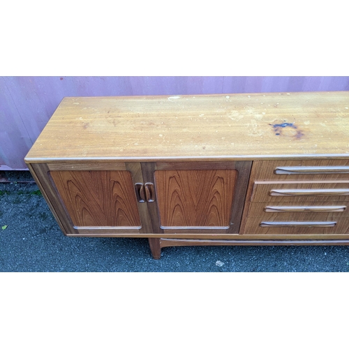 109 - A mid 20th century G-Plan Fresco range teak sideboard, designed by Victor B Wilkins, having four cen... 