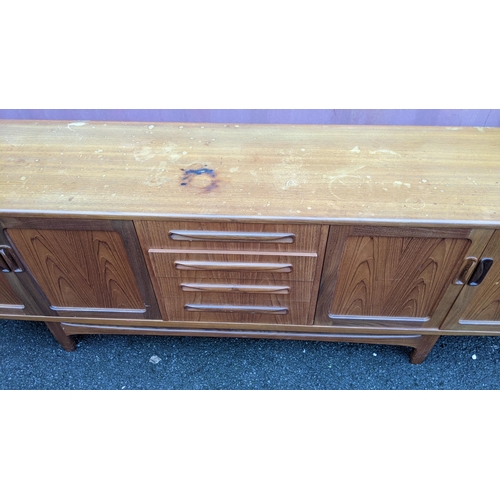 109 - A mid 20th century G-Plan Fresco range teak sideboard, designed by Victor B Wilkins, having four cen... 