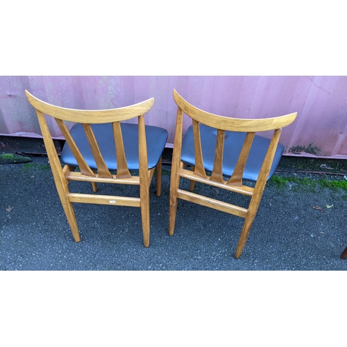 110 - A mid 20th century retro teak extending dining table together with six teak dining chairs, the table... 