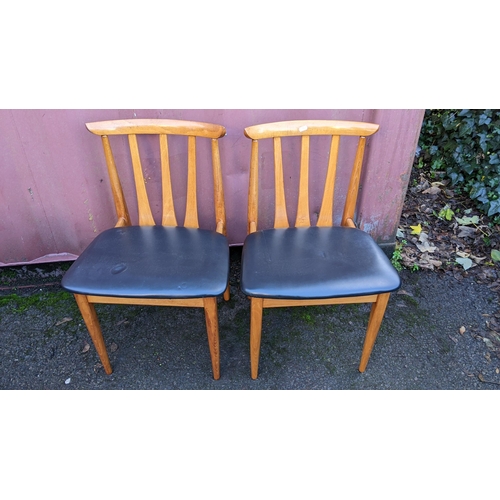 110 - A mid 20th century retro teak extending dining table together with six teak dining chairs, the table... 