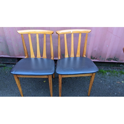 110 - A mid 20th century retro teak extending dining table together with six teak dining chairs, the table... 