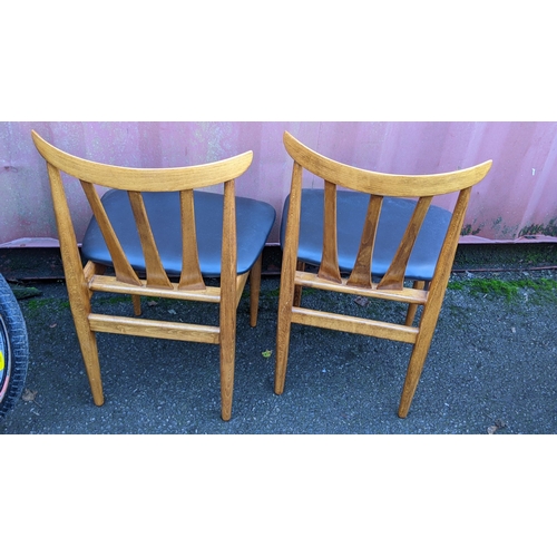 110 - A mid 20th century retro teak extending dining table together with six teak dining chairs, the table... 