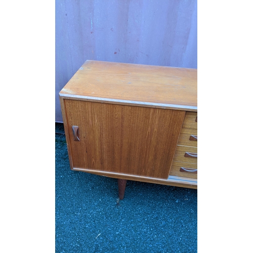 112 - Clausen & Son - A retro 20th century Danish designer teak sideboard credenza having a central bank f... 