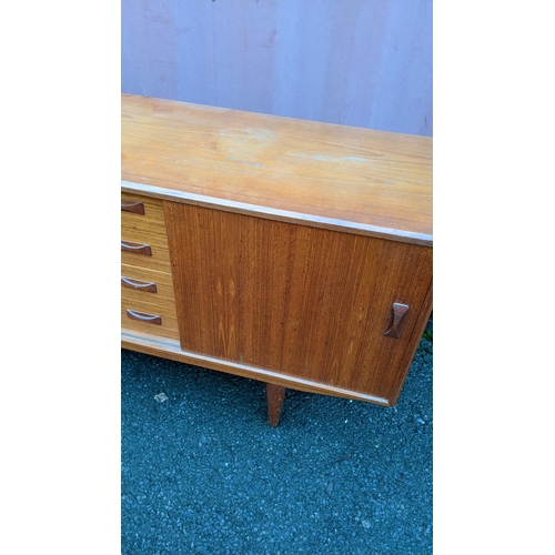 112 - Clausen & Son - A retro 20th century Danish designer teak sideboard credenza having a central bank f... 