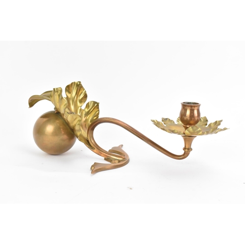 135 - An Arts & Crafts single arm copper and brass counterbalanced candlestick, attributed to W.A.S. Benso... 