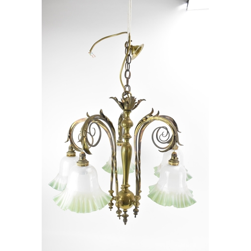 145 - An Aesthetic movement brass chandelier, chain supported, the centre column having applied acanthus l... 