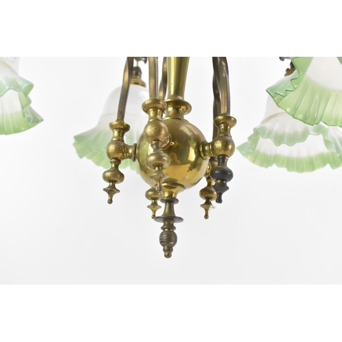 145 - An Aesthetic movement brass chandelier, chain supported, the centre column having applied acanthus l... 