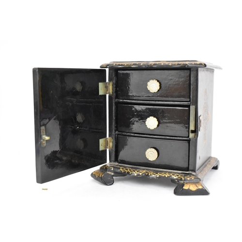 157 - A Victorian ebonised papier-mache jewellery cabinet, decorated in gilt throughout the exterior, the ... 