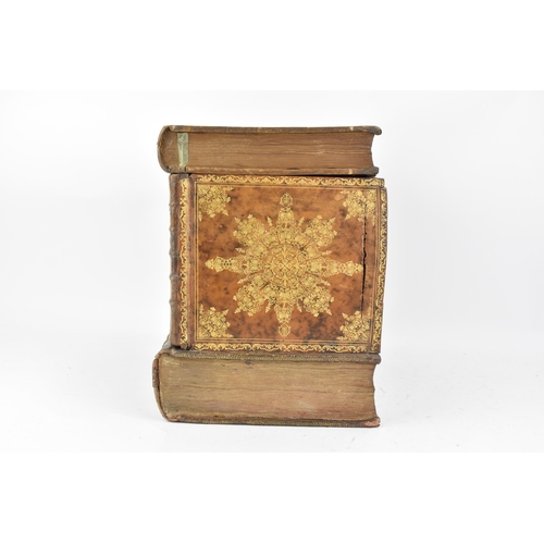 159 - An An early 20th century French leather bound Tantalus in the form of a stack of books, the exterior... 