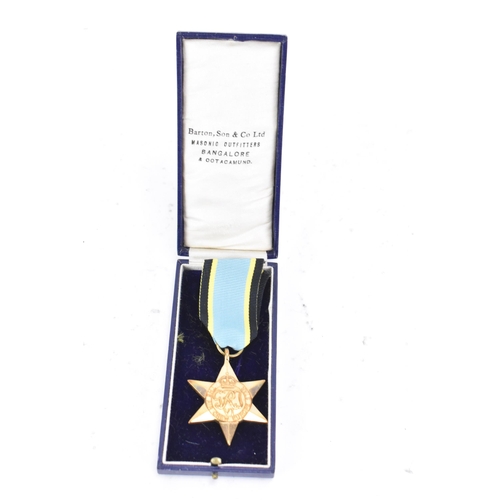 165 - A post Second World War replica of an Air Crew Europe Star medal, un-inscribed, with ribbon
If there... 