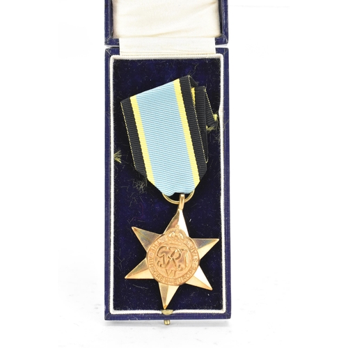 165 - A post Second World War replica of an Air Crew Europe Star medal, un-inscribed, with ribbon
If there... 