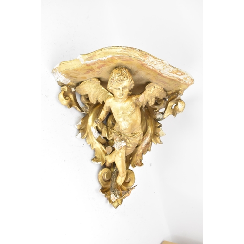 167 - A 19th century gilt gesso corner wall hanging bracket, in the form of a winged cherub among a floral... 