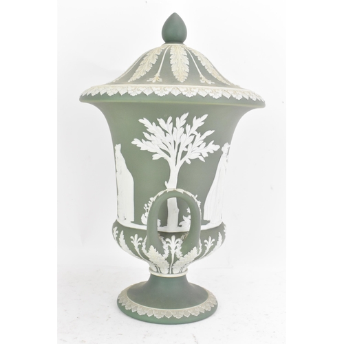 177 - A circa 1900 Wedgwood jasperware vase and cover, of Campana form, in sage green, with twin loop hand... 