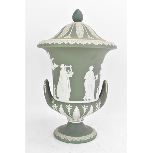 177 - A circa 1900 Wedgwood jasperware vase and cover, of Campana form, in sage green, with twin loop hand... 