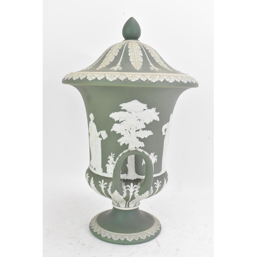 177 - A circa 1900 Wedgwood jasperware vase and cover, of Campana form, in sage green, with twin loop hand... 