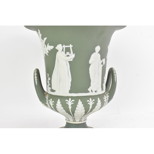 177 - A circa 1900 Wedgwood jasperware vase and cover, of Campana form, in sage green, with twin loop hand... 