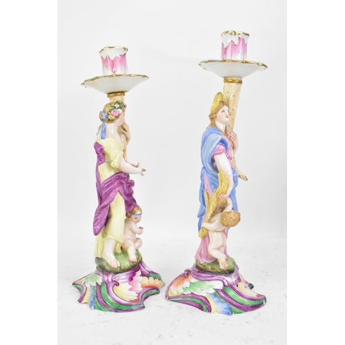 181 - Two 19th century Capodimonte porcelain figural candlesticks, each painted in polychrome enamels, eac... 