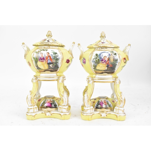 182 - A pair of KPM Berlin porcelain pot pourri's or pastille burners, the twin handled bowls on scroll su... 