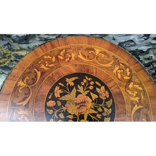 183 - A 19th century wine table, having a walnut veneered top, marquetry inlaid with a flowers to the cent... 