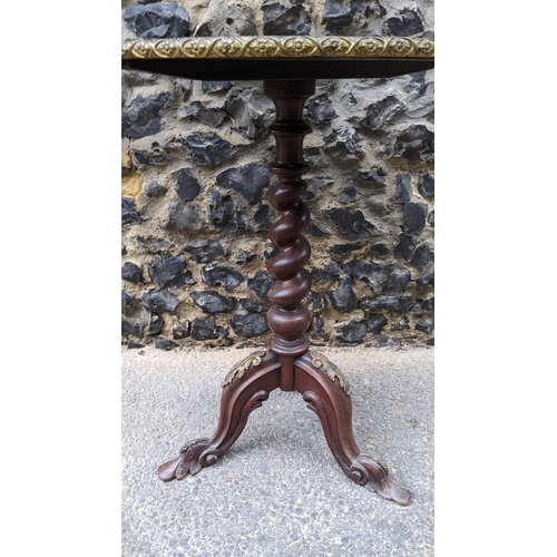 183 - A 19th century wine table, having a walnut veneered top, marquetry inlaid with a flowers to the cent... 