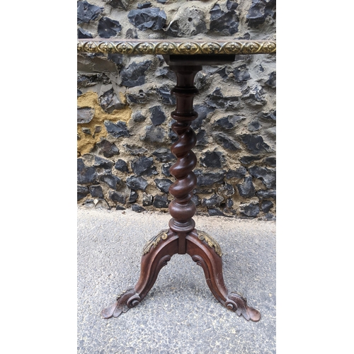 183 - A 19th century wine table, having a walnut veneered top, marquetry inlaid with a flowers to the cent... 