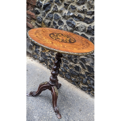 183 - A 19th century wine table, having a walnut veneered top, marquetry inlaid with a flowers to the cent... 