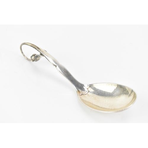 2 - A 1930's Georg Jensen 925 silver caddy spoon, import marks for London 1930, having a stylised scroll... 