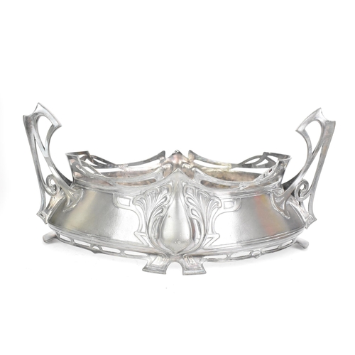 20 - An Art Nouveau WMF pewter jardiniere, of oval form and having twin pierced handles, moulded with sty... 