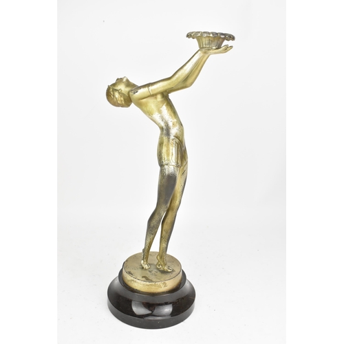 23 - An Art Deco silvered spelter table figural table lamp, in the form of a nude posed lady, mounted on ... 