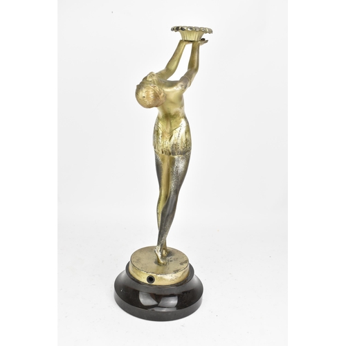 23 - An Art Deco silvered spelter table figural table lamp, in the form of a nude posed lady, mounted on ... 