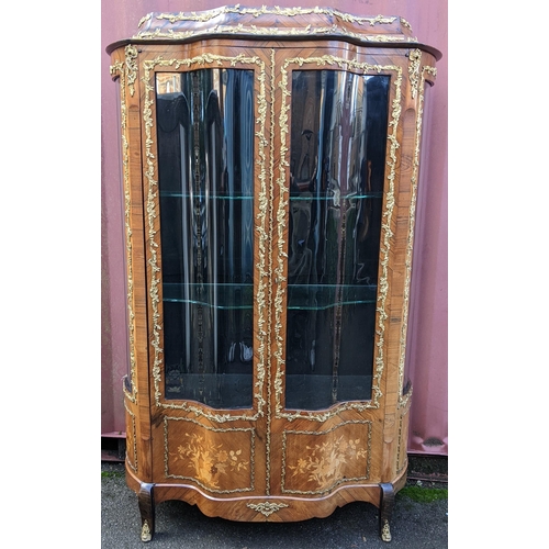 236 - A 19th century French Louis XV style kingwood vitrine display cabinet, serpentine fronted with twin ... 